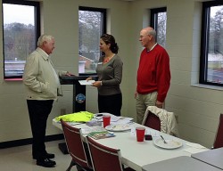 Mayor Owens hands Kimberly Etheridge a check for $5,810.