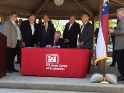 Gov Deal signs HB777 in Hartwell Wednesday as lawmakers from Georgia and South Carolina look on