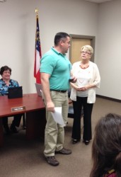 Jason Ayers accepts certificate from Dr. Ruth O'Dell Monday night.