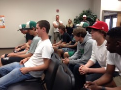 Drew Davis (left front) and other Lions Baseball Team members address Franklin BOE Thursday on coach firing
