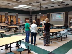 Dr. O'Dell chats with visitors in the new cafeteria