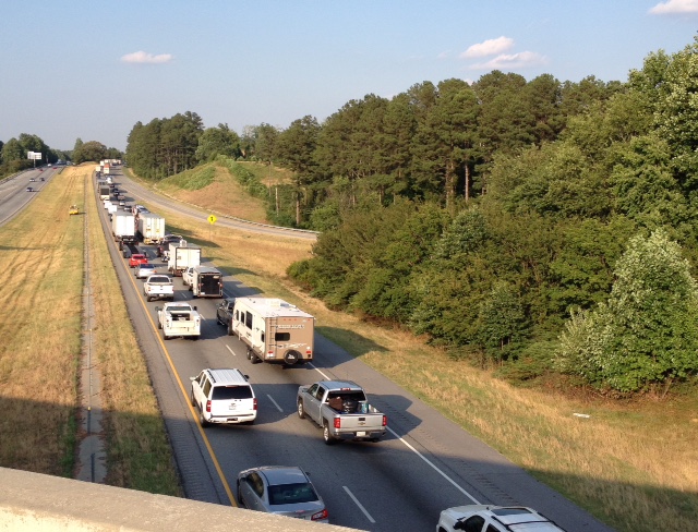 Traffic was backed up for miles on I-85 Thursday evening as crews worked to clear the overturned 18-wheeler.
